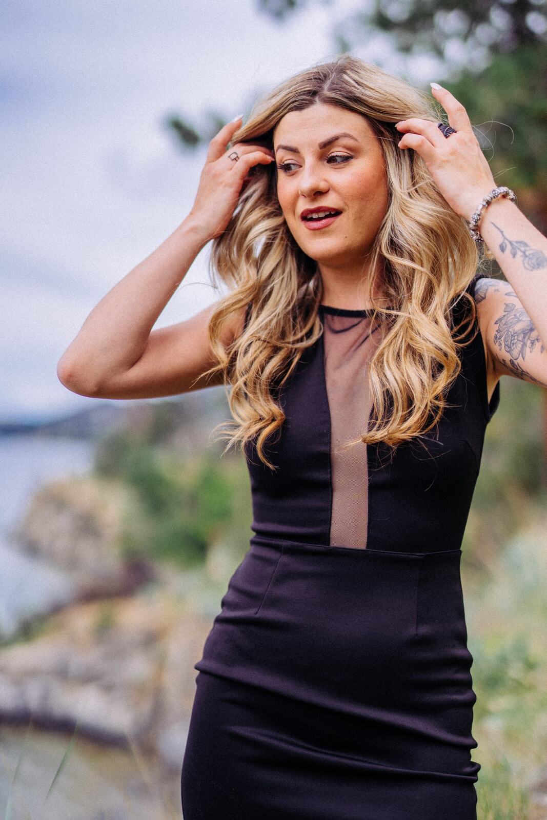 Sophia at Paul's Tomb portraits story frame 8: Lake, rock, trees, wind and a quieter location portrait mood above Okanagan Lake.