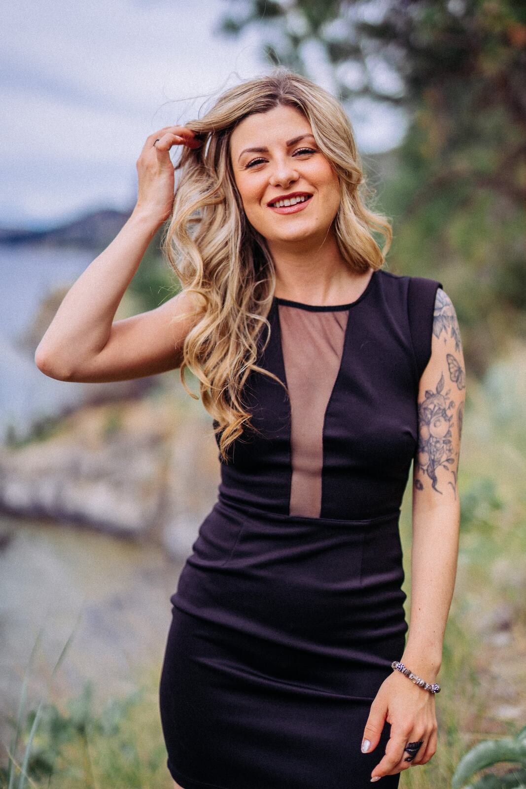 Sophia at Paul's Tomb portraits story frame 10: Lake, rock, trees, wind and a quieter location portrait mood above Okanagan Lake.