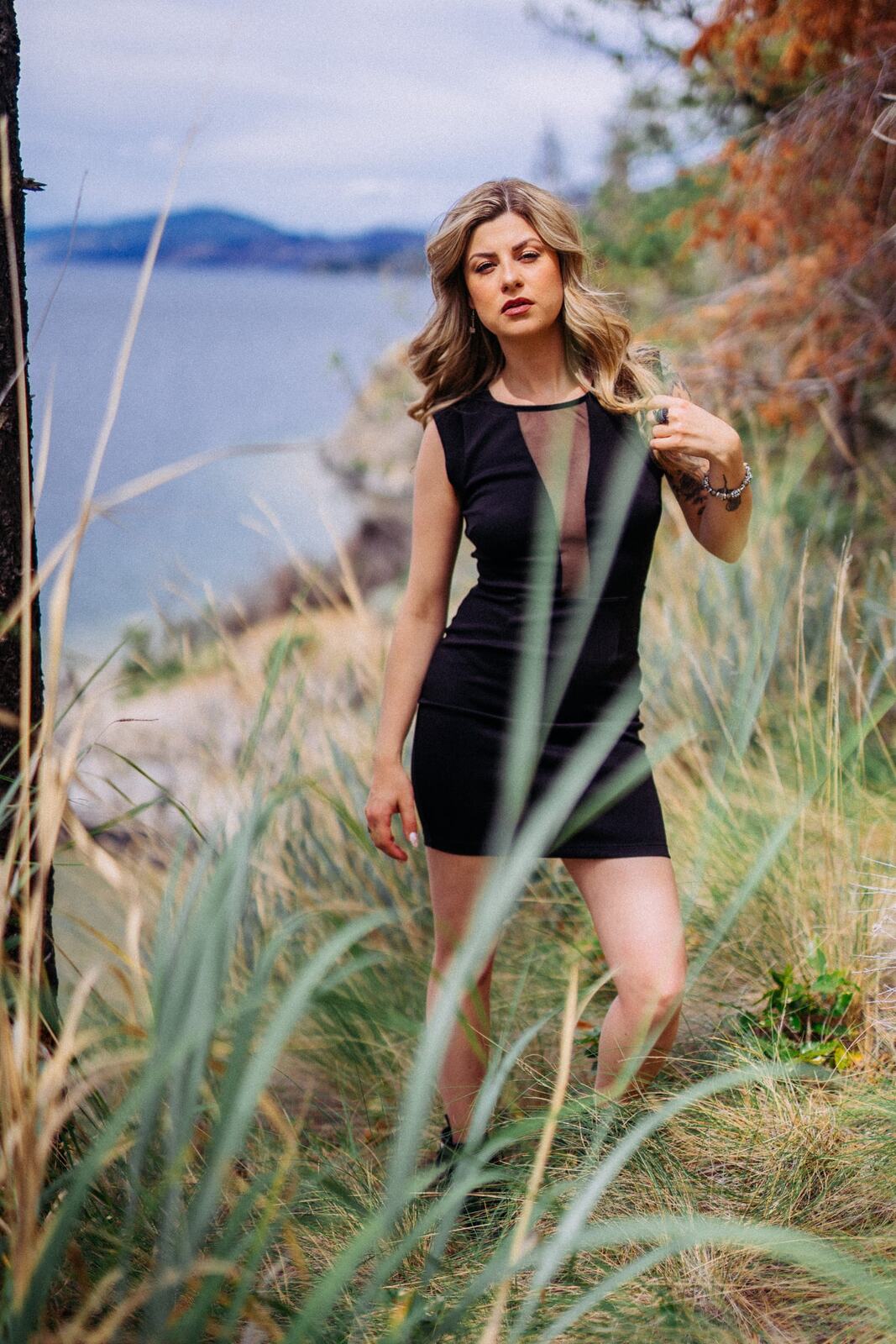 Sophia at Paul's Tomb portraits story frame 19: Lake, rock, trees, wind and a quieter location portrait mood above Okanagan Lake.