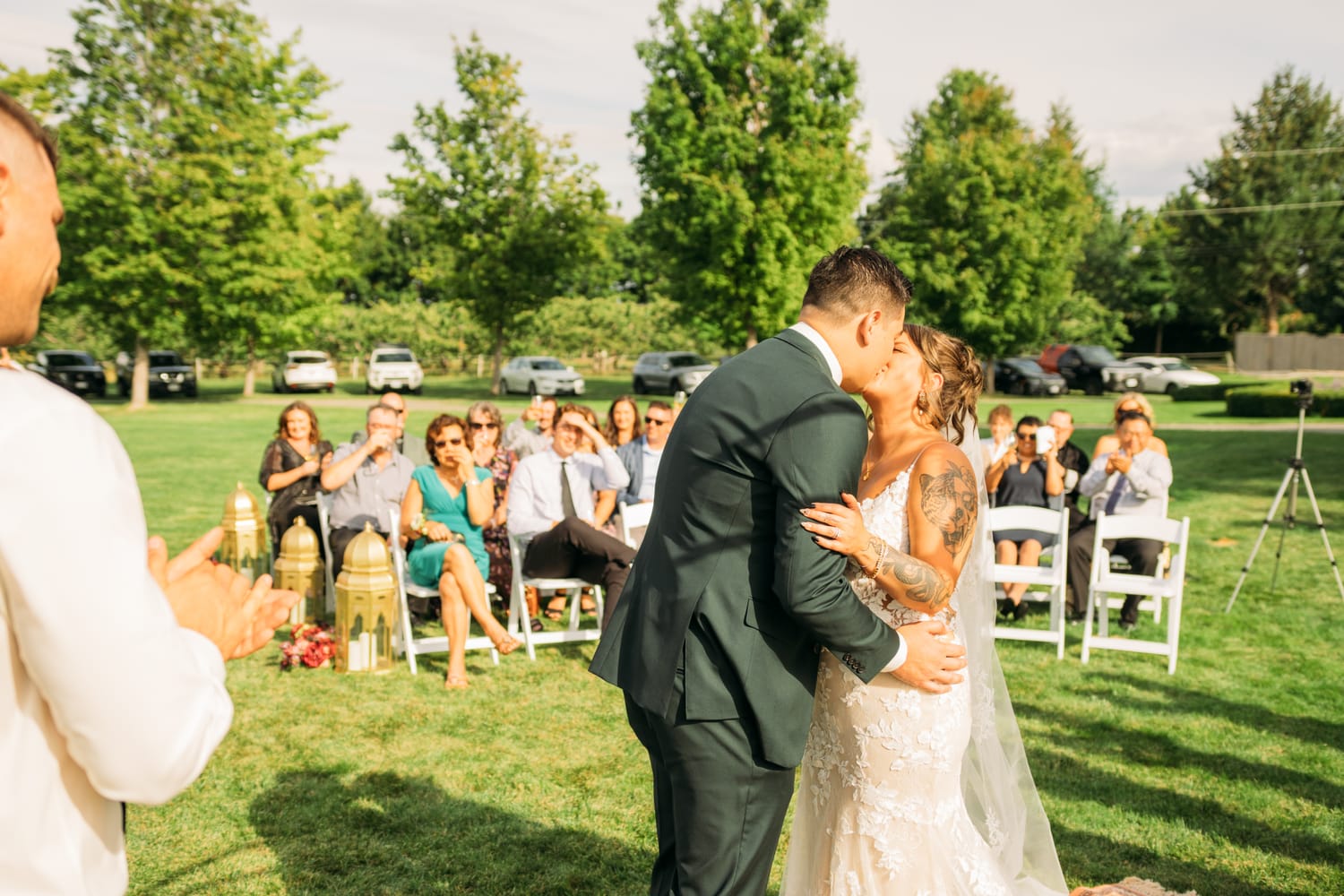 Taryn and Kai weddings story frame 20: An Okanagan vineyard wedding with ceremony, veil, guests, family, makeup by Guisachan Esthetics, and laughter woven through the altar moments..
