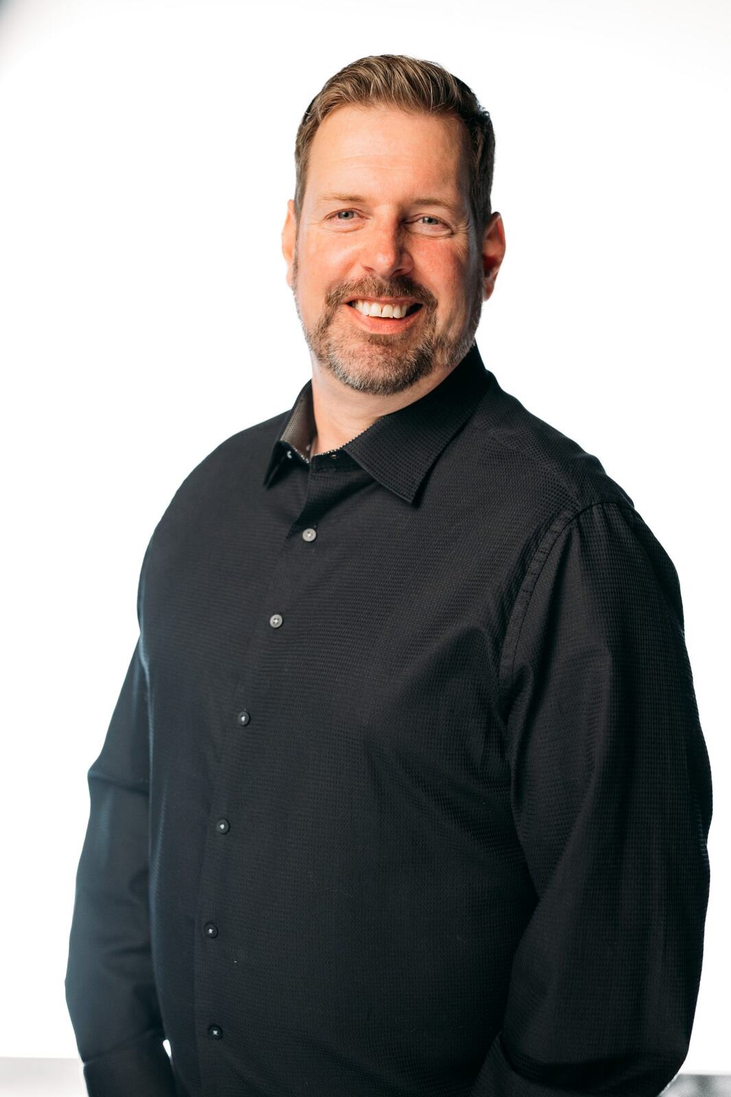 Team Bennett corporate story frame 7: Real estate team portraits in Kelowna, with individual headshots, group photos and clean marketing images for profiles, listings and business use..