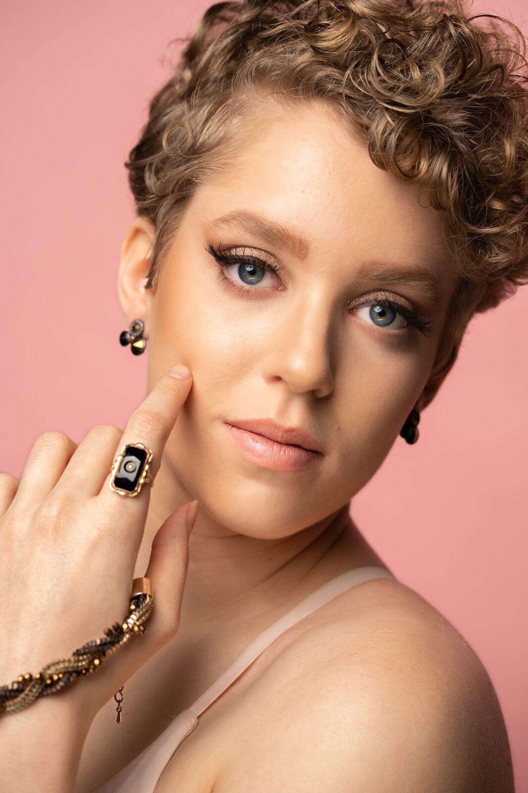 The Barbershoppe / Diva Den Bridal Formals corporate story frame 20: Collaborative bridal-formal brand photography for The Barbershoppe and Diva Den Day Spa, with hair, makeup, formal looks, studio portraits and campaign-ready beauty imagery..