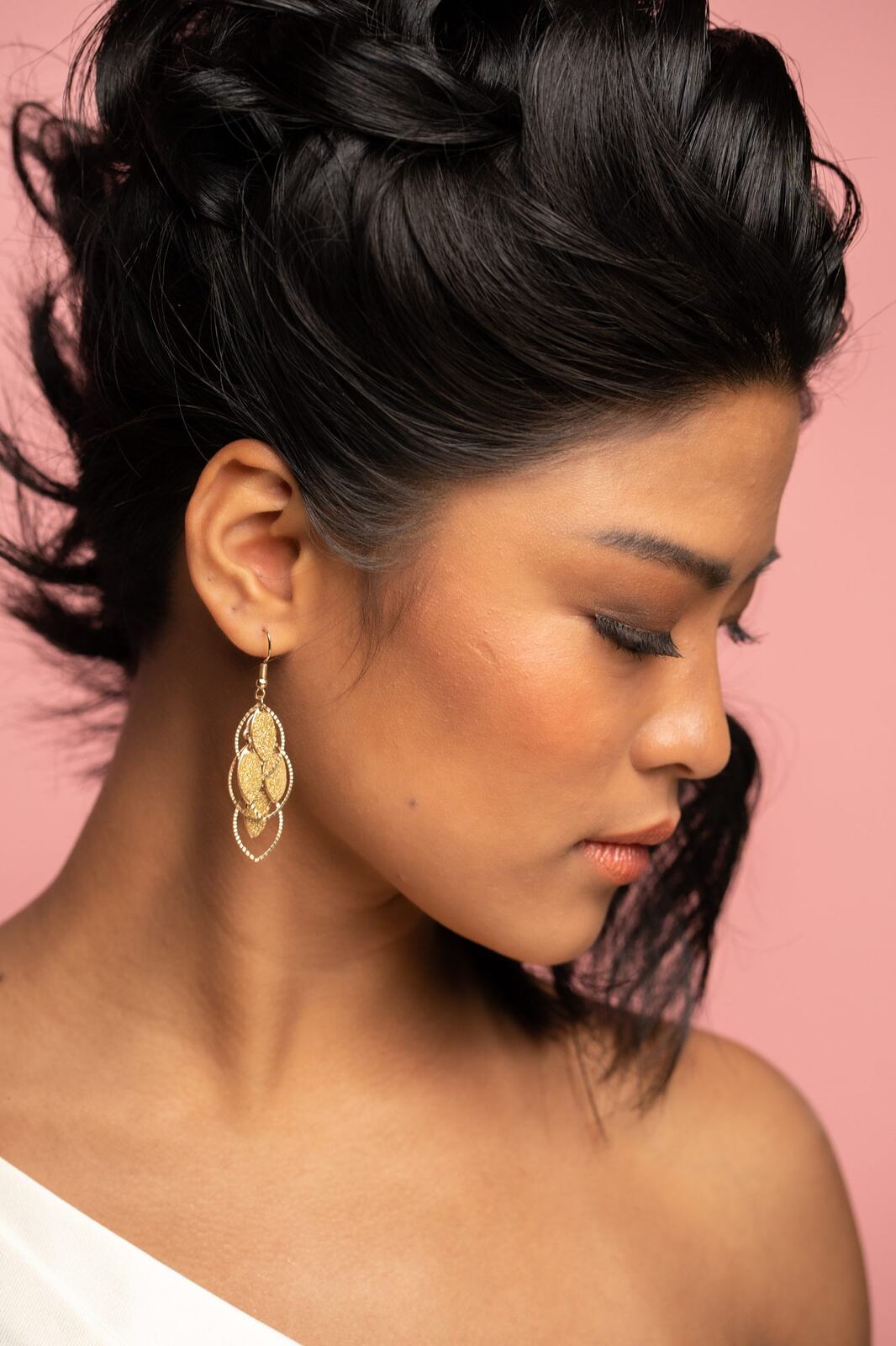 The Barbershoppe / Diva Den Bridal Formals corporate story frame 26: Collaborative bridal-formal brand photography for The Barbershoppe and Diva Den Day Spa, with hair, makeup, formal looks, studio portraits and campaign-ready beauty imagery..