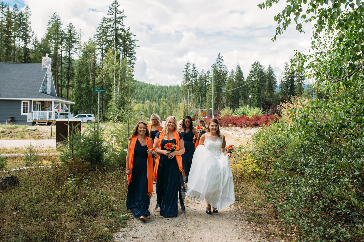 Tia and Matt weddings story frame 7: A Mabel Lake Airpark wedding in the North Okanagan, with grass-runway scenery, mountain openness and a warm end-of-night invitation..