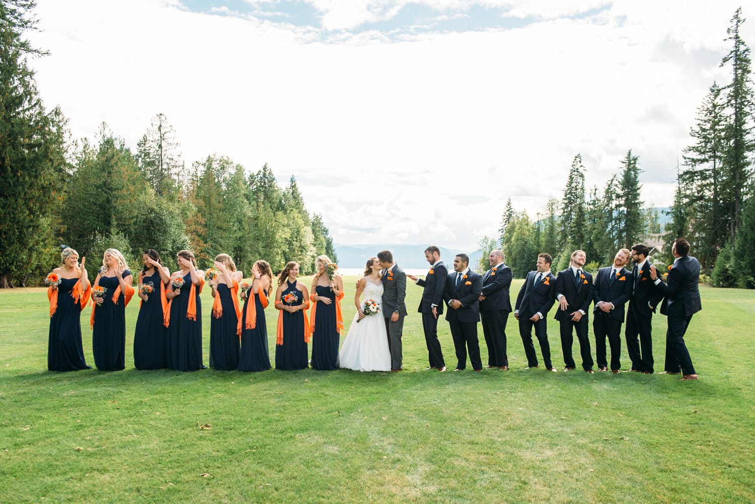 Tia and Matt weddings story frame 13: A Mabel Lake Airpark wedding in the North Okanagan, with grass-runway scenery, mountain openness and a warm end-of-night invitation..