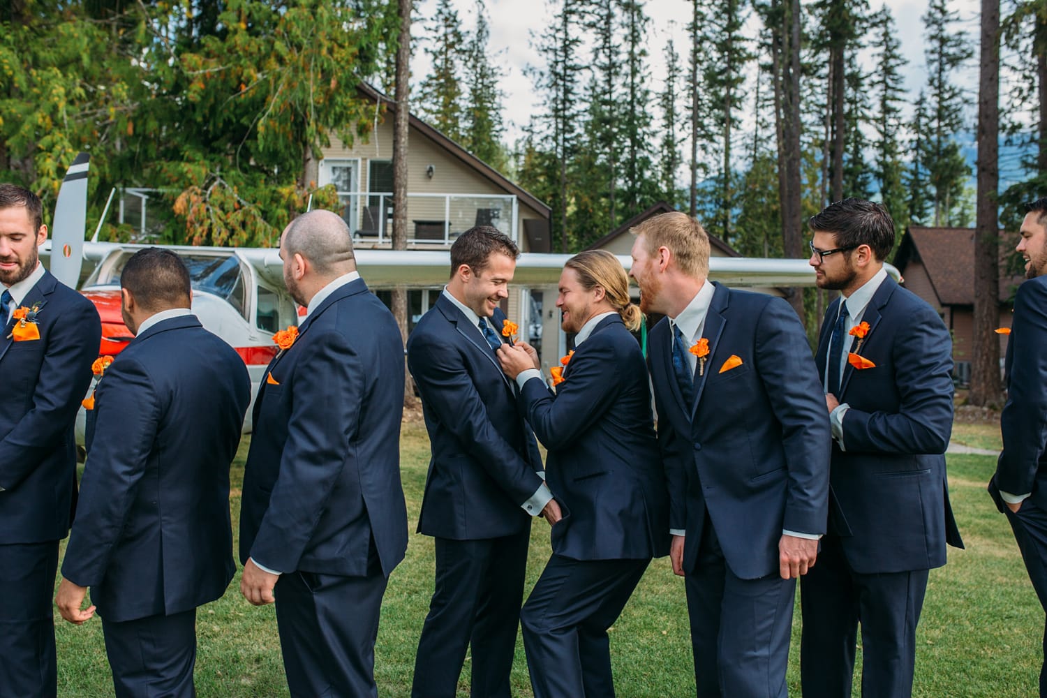 Tia and Matt weddings story frame 14: A Mabel Lake Airpark wedding in the North Okanagan, with grass-runway scenery, mountain openness and a warm end-of-night invitation..