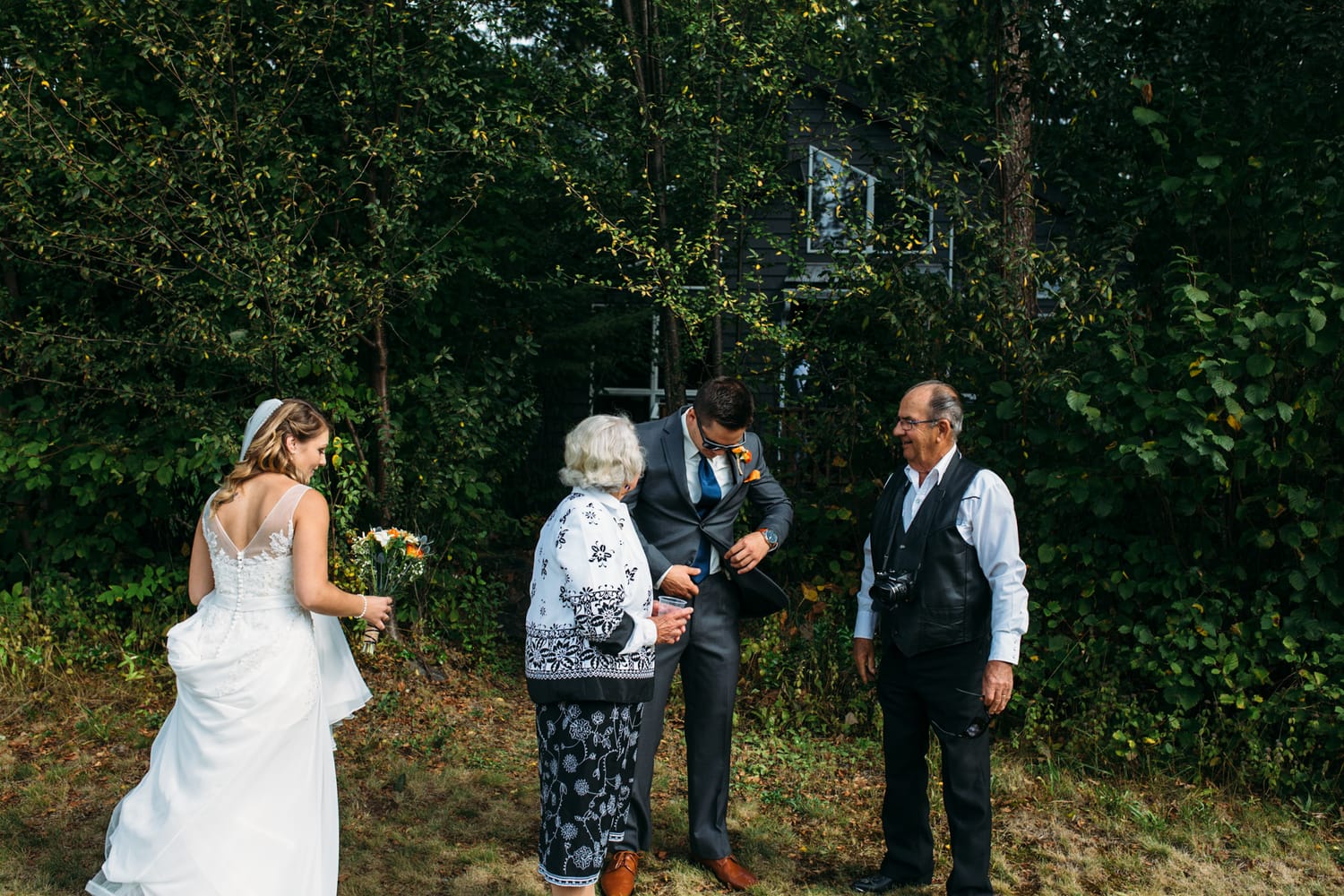 Tia and Matt weddings story frame 16: A Mabel Lake Airpark wedding in the North Okanagan, with grass-runway scenery, mountain openness and a warm end-of-night invitation..