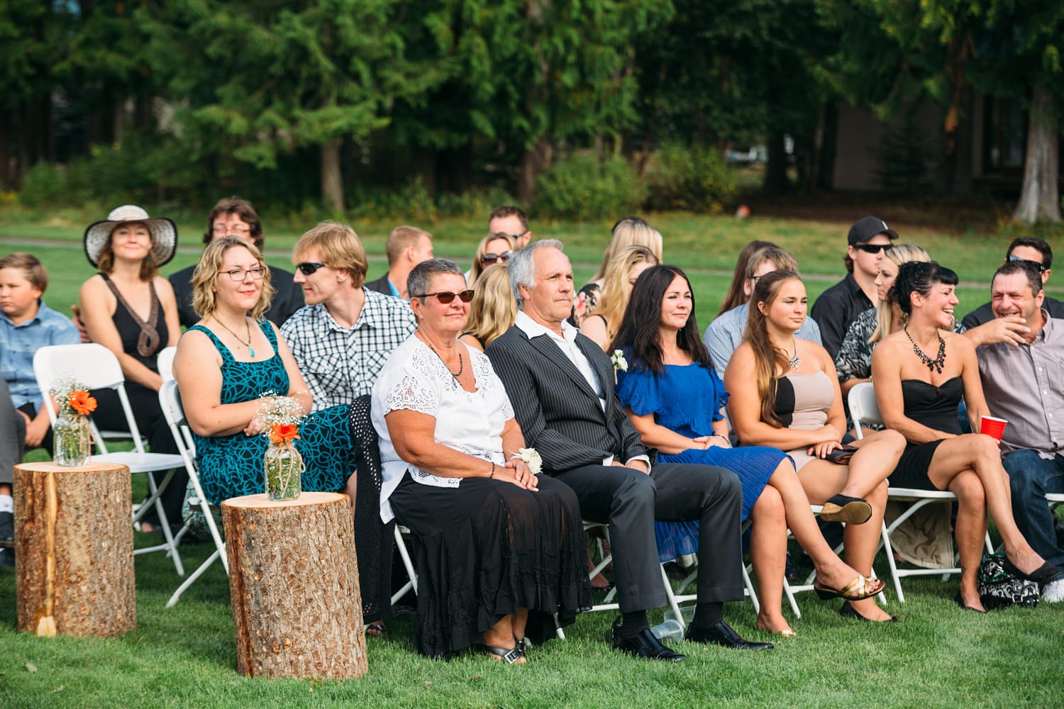 Tia and Matt weddings story frame 20: A Mabel Lake Airpark wedding in the North Okanagan, with grass-runway scenery, mountain openness and a warm end-of-night invitation..